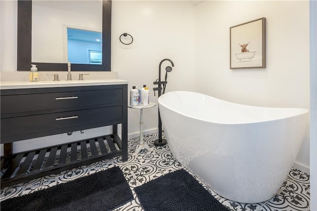 1701 Meadville St, Fineview, PA 15214 - full bath with vanity, tile patterned floors, baseboards, and a soaking tub