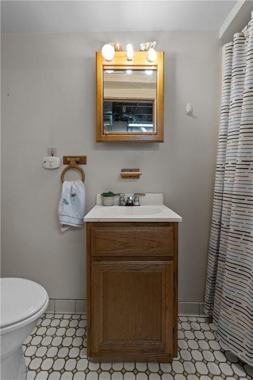 2920 Roland Ave, Baldwin Boro, PA 15227 - full bathroom with vanity, toilet, curtained shower, and tile patterned floors