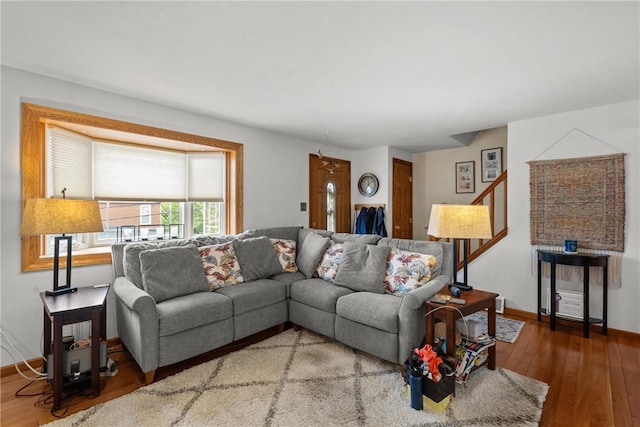 2920 Roland Ave, Baldwin Boro, PA 15227 - living room with wood finished floors, stairway, and baseboards