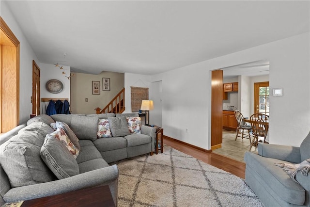 2920 Roland Ave, Baldwin Boro, PA 15227 - living room with stairs and light wood-style flooring