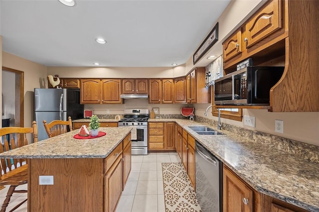 1408 Fernledge Dr, Shaler, PA 15101 - kitchen with appliances with stainless steel finishes, a sink, brown cabinetry, light tile patterned floors, and under cabinet range hood