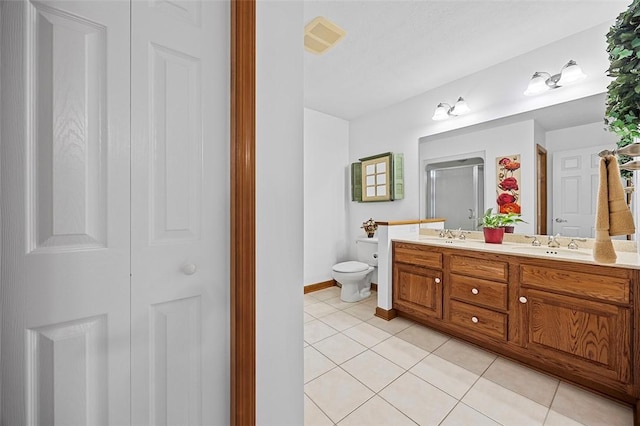 1408 Fernledge Dr, Shaler, PA 15101 - bathroom with double vanity, tile patterned flooring, toilet, an enclosed shower, and baseboards