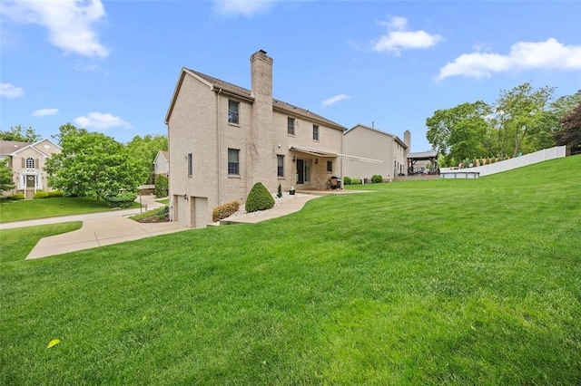 1408 Fernledge Dr, Shaler, PA 15101 - rear view of house with a garage, a chimney, concrete driveway, and stucco siding