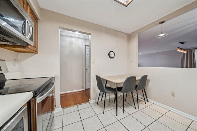 4677 Bayard St Unit 201, Oakland, PA 15213 - dining space featuring baseboards and light tile patterned flooring