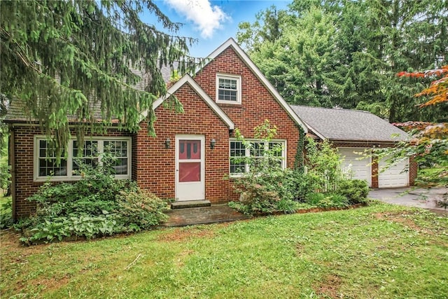 1060 S Hermitage Rd, Hermitage, PA 16148 - english style home featuring brick siding, a front yard, a garage, and a shingled roof