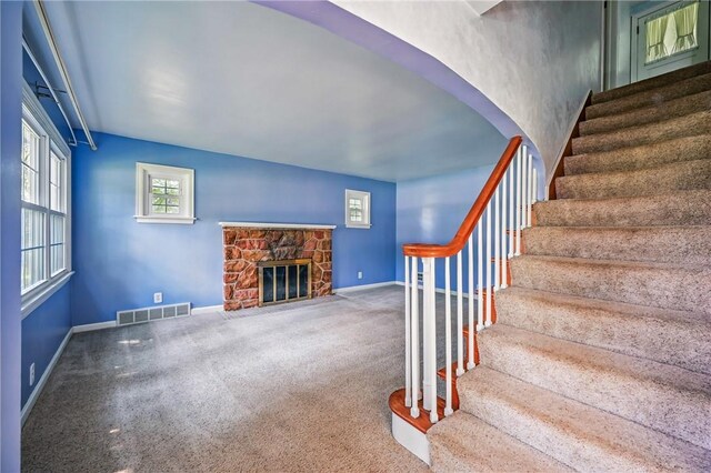 1060 S Hermitage Rd, Hermitage, PA 16148 - staircase featuring carpet flooring, baseboards, and a stone fireplace