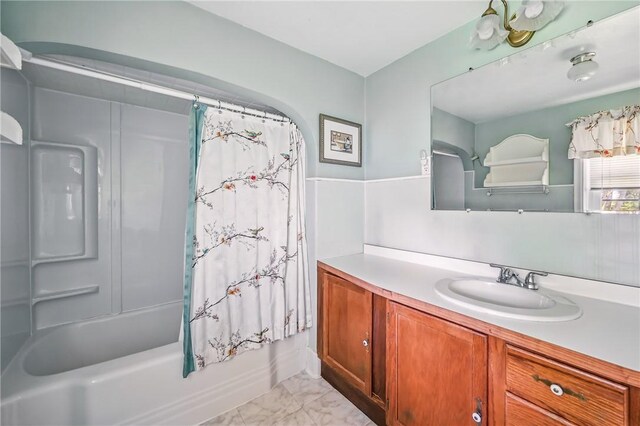 1060 S Hermitage Rd, Hermitage, PA 16148 - full bath featuring vanity, marble look tiles, and shower / bath combo with shower curtain