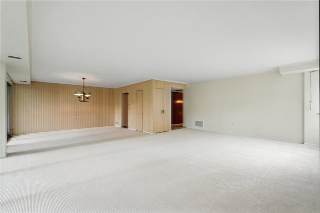 5048 5th Ave Unit 101, Shadyside, PA 15232 - carpeted empty room featuring a chandelier