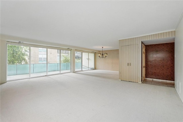 5048 5th Ave Unit 101, Shadyside, PA 15232 - unfurnished room featuring light colored carpet, a chandelier, ornamental molding, and baseboards