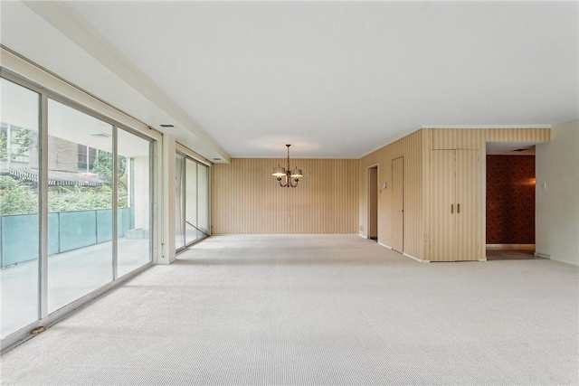 5048 5th Ave Unit 101, Shadyside, PA 15232 - empty room with a chandelier and light colored carpet