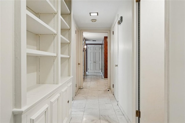 5048 5th Ave Unit 101, Shadyside, PA 15232 - hall featuring light marble finish flooring and baseboards