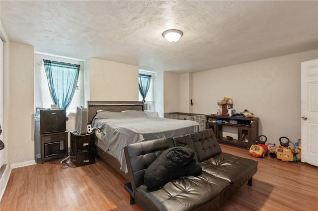 1332 Diana St, Troy Hill, PA 15212 - bedroom featuring light wood-style flooring and a textured ceiling