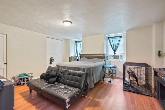 1332 Diana St, Troy Hill, PA 15212 - bedroom featuring cooling unit, wood finished floors, a closet, and baseboards