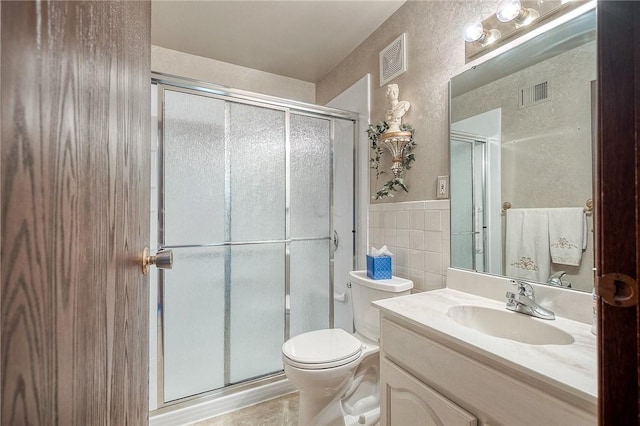 551 Sloop Dr Unit 61, Mccandless, PA 15237 - bathroom featuring a shower stall, vanity, toilet, and tile walls