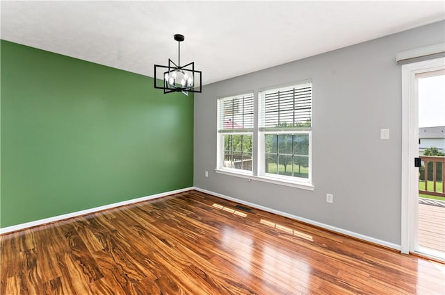 2000 Michael Dr, Baldwin Boro, PA 15227 - empty room with a chandelier, baseboards, and wood finished floors