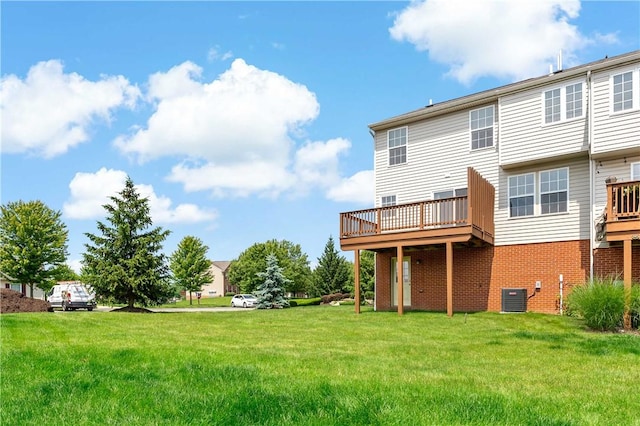 2000 Michael Dr, Baldwin Boro, PA 15227 - back of house featuring central AC unit, a lawn, a deck, and brick siding