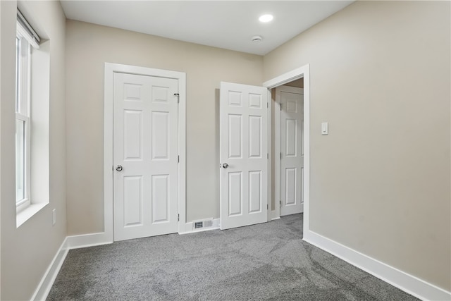 635 9th St, Freedom, PA 15042 - unfurnished bedroom featuring dark carpet and baseboards