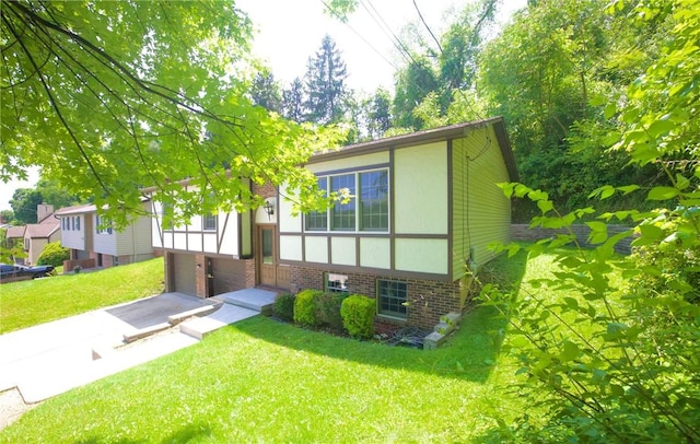 906 Arch Ave, Castle Shannon, PA 15234 - view of front of home with a garage, a front lawn, and brick siding