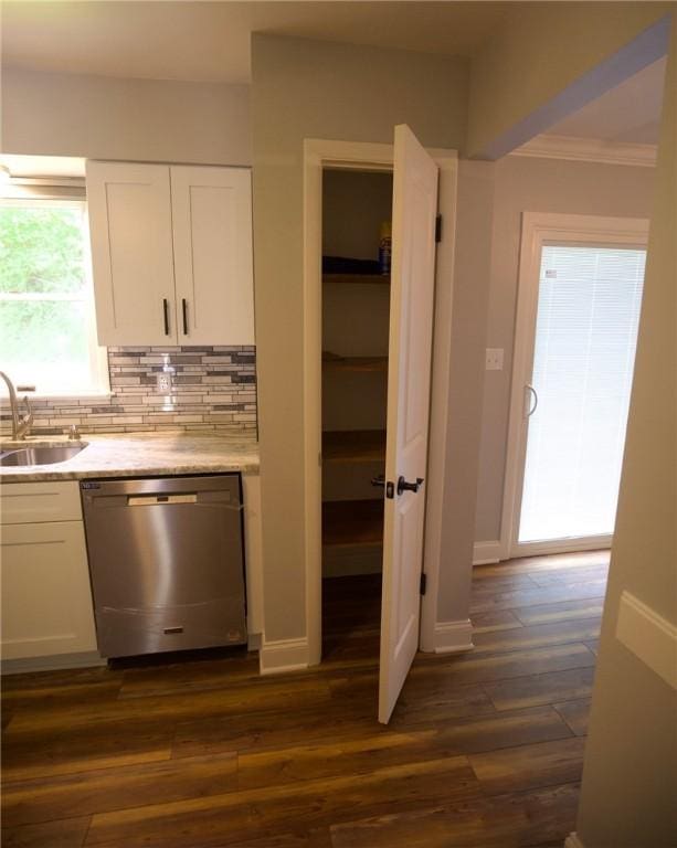 906 Arch Ave, Castle Shannon, PA 15234 - kitchen with dishwasher, a sink, white cabinetry, decorative backsplash, and ornamental molding