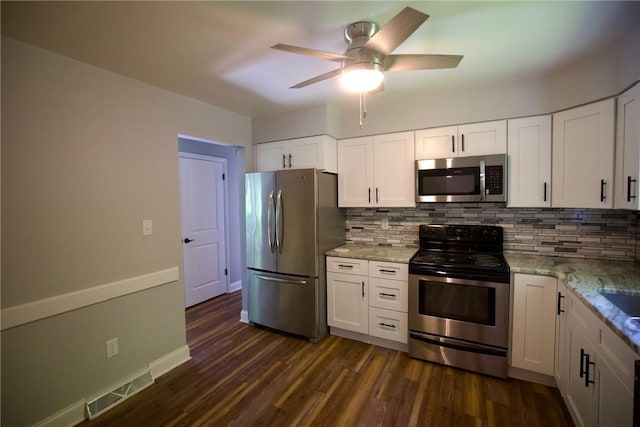 906 Arch Ave, Castle Shannon, PA 15234 - kitchen featuring appliances with stainless steel finishes, backsplash, and dark wood-style floors