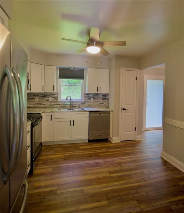 906 Arch Ave, Castle Shannon, PA 15234 - kitchen featuring appliances with stainless steel finishes, a sink, white cabinets, light countertops, and backsplash