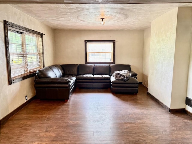 128 Main St, Perry Twp Fay, PA 15473 - living area with wood finished floors, baseboards, a textured wall, and a textured ceiling