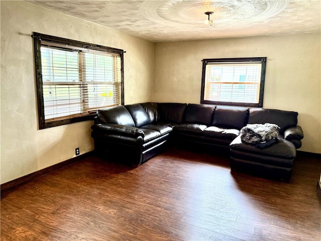128 Main St, Perry Twp Fay, PA 15473 - living area featuring wood finished floors, healthy amount of natural light, and a textured ceiling