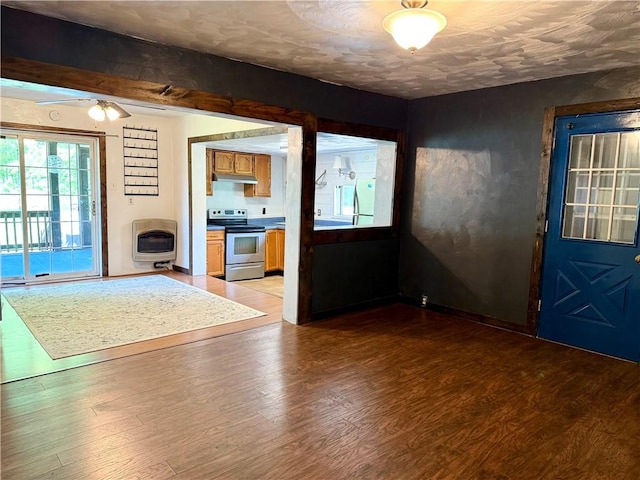 128 Main St, Perry Twp Fay, PA 15473 - unfurnished living room featuring heating unit and light wood finished floors