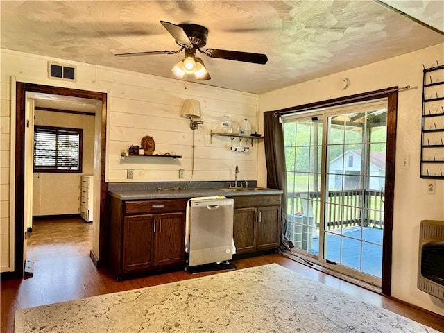128 Main St, Perry Twp Fay, PA 15473 - indoor wet bar featuring stainless steel dishwasher, heating unit, dark wood-type flooring, plenty of natural light, and wooden walls