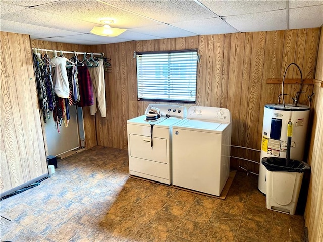 128 Main St, Perry Twp Fay, PA 15473 - washroom with water heater, washing machine and dryer, and wooden walls