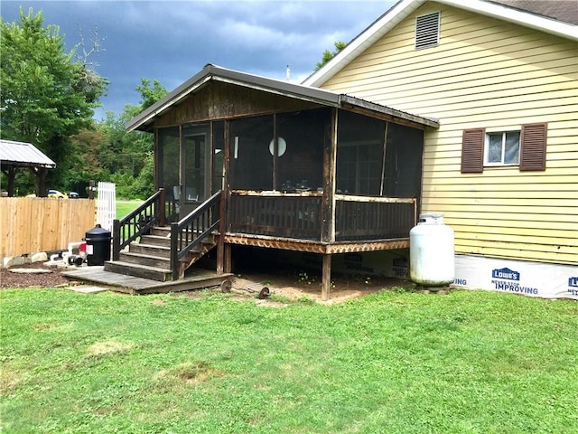 128 Main St, Perry Twp Fay, PA 15473 - back of property featuring a sunroom and crawl space
