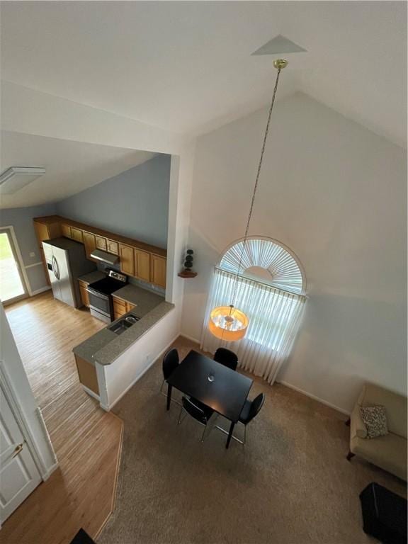 206 Saddlebrook Dr, White Twp Ind, PA 15701 - dining area featuring high vaulted ceiling and baseboards