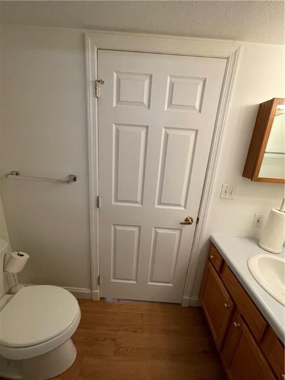206 Saddlebrook Dr, White Twp Ind, PA 15701 - half bath with vanity, wood finished floors, toilet, and baseboards