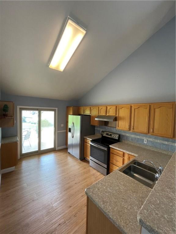 206 Saddlebrook Dr, White Twp Ind, PA 15701 - kitchen featuring stainless steel appliances, under cabinet range hood, a sink, lofted ceiling, and light wood-type flooring