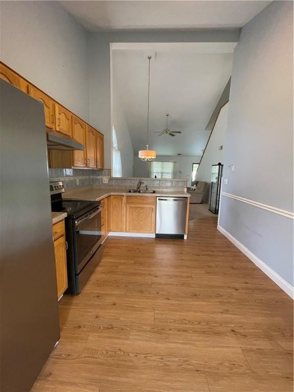 206 Saddlebrook Dr, White Twp Ind, PA 15701 - kitchen featuring stainless steel appliances, under cabinet range hood, a ceiling fan, open floor plan, and a peninsula