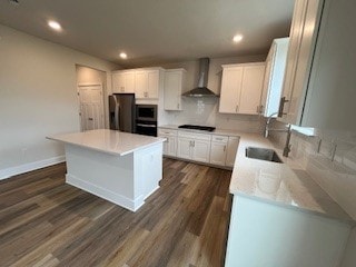 328 Stately Ct, Adams Twp, PA 16046 - kitchen featuring wall chimney exhaust hood, fridge, a sink, dark wood-type flooring, and recessed lighting
