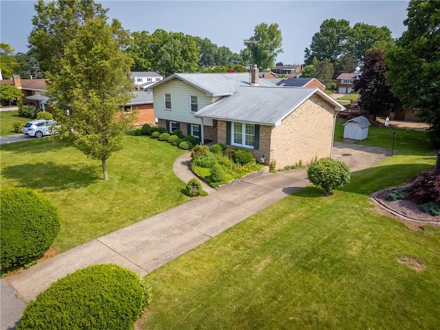 216 Bainbridge Dr, Center Twp Bea, PA 15001 - view of front facade with a front lawn, a chimney, driveway, and brick siding