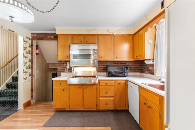 216 Bainbridge Dr, Center Twp Bea, PA 15001 - kitchen with black microwave, stainless steel microwave, light countertops, dishwasher, and crown molding