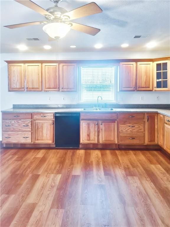 121 Columbus Dr, Punxsutawney Area School District, PA 15767 - kitchen with black dishwasher, a sink, ceiling fan, light wood-style floors, and glass insert cabinets