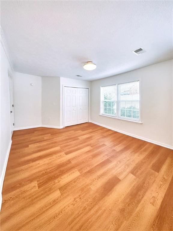 121 Columbus Dr, Punxsutawney Area School District, PA 15767 - unfurnished bedroom featuring baseboards, light wood finished floors, and a closet