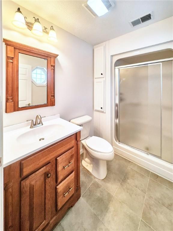 121 Columbus Dr, Punxsutawney Area School District, PA 15767 - bathroom with vanity, a stall shower, and toilet