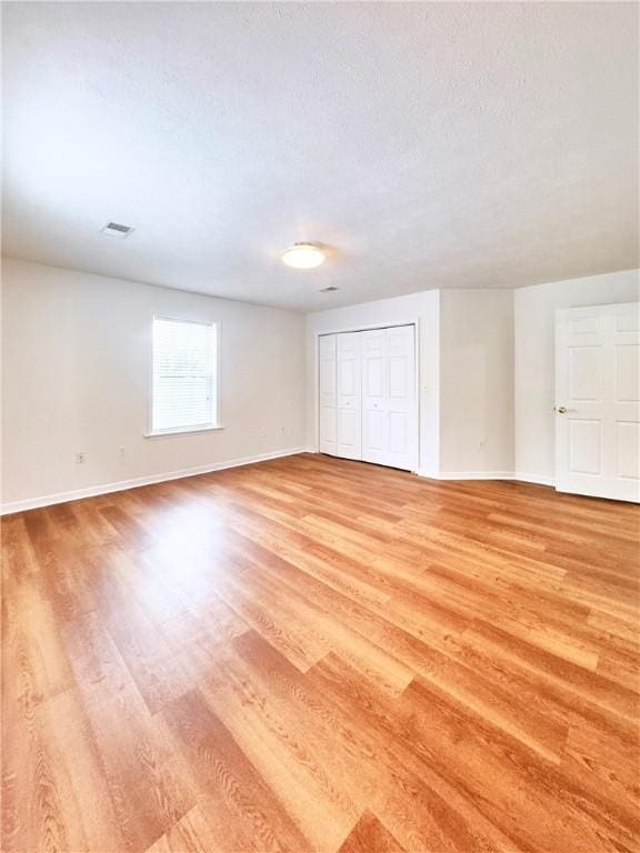 121 Columbus Dr, Punxsutawney Area School District, PA 15767 - unfurnished bedroom featuring light wood finished floors, baseboards, and a closet