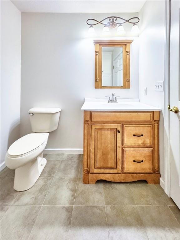 121 Columbus Dr, Punxsutawney Area School District, PA 15767 - bathroom with toilet, vanity, baseboards, and tile patterned flooring