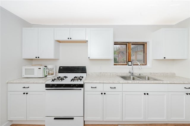 721 W Mahoning St, Punxsutawney Area School District, PA 15767 - kitchen featuring white appliances, a sink, white cabinets, and ornamental molding