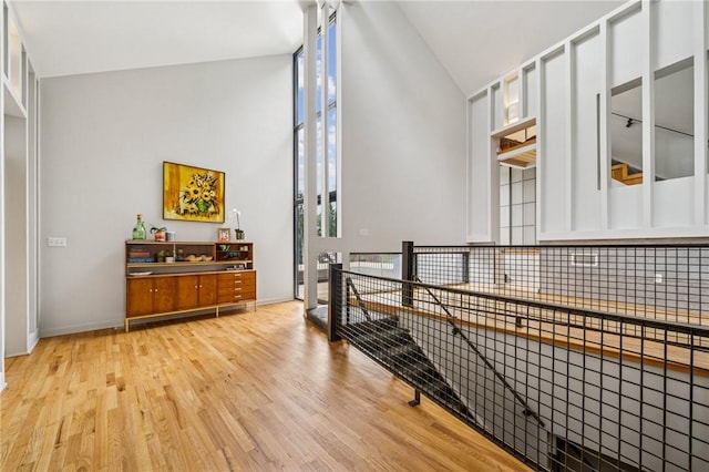 340 Lakewood Rd, Unity Twp, PA 15601 - corridor featuring high vaulted ceiling, light wood finished floors, and baseboards
