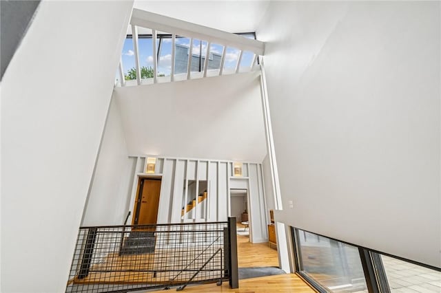 340 Lakewood Rd, Unity Twp, PA 15601 - stairway featuring wood finished floors and a towering ceiling