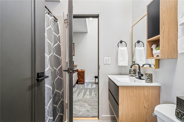 340 Lakewood Rd, Unity Twp, PA 15601 - bathroom with vanity, toilet, a shower with shower curtain, and baseboards