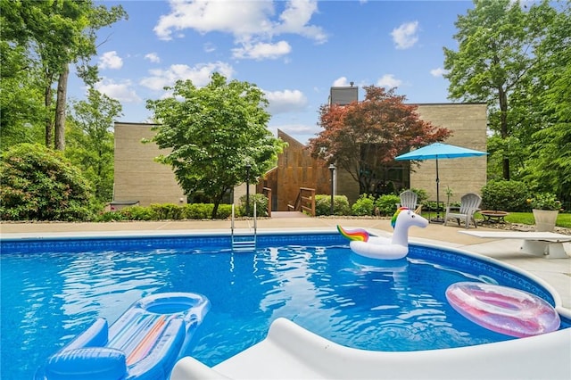 340 Lakewood Rd, Unity Twp, PA 15601 - view of swimming pool with a diving board and a patio