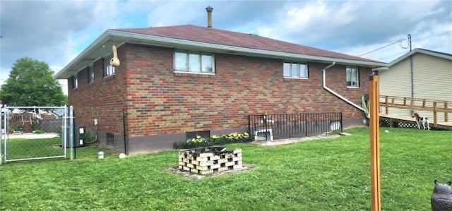 132 Sherwood St, Belle Vernon Fay, PA 15012 - back of house featuring a yard and brick siding