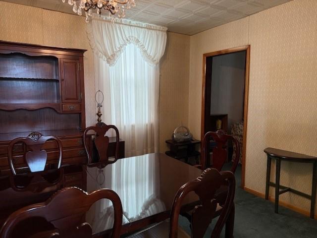 134 E Harvey Ave, Masontown, PA 15461 - carpeted dining space featuring a chandelier, wallpapered walls, and baseboards